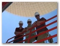 David, Lew, and David climbing aboard the DSS-14 structure