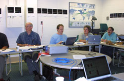 Fig. 4 Members of the science team working on the sequence review. From left to right, Ken Klaasen (JPL), Tony Farnham (UMd), Jessica Sunshine (SAIC), Pete Schultz (Brown University).